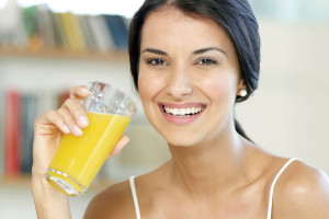 Woman-drinking-orange-juice-1154361